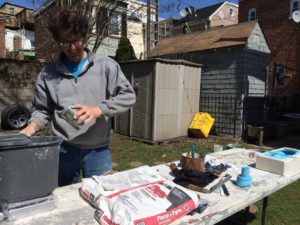 Mike Bowman weighing out DAP Plaster of Paris to cast cicada sculptures